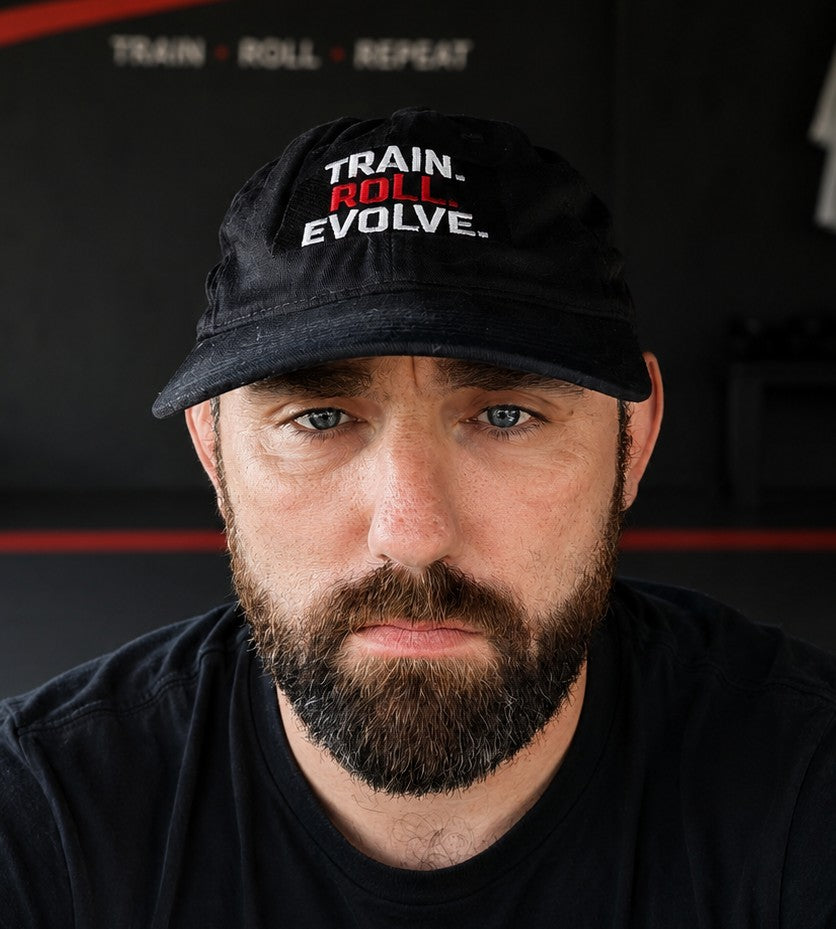 Train. Roll. Evolve. Embroidered Baseball Cap — Organic Cotton Fitness Hat